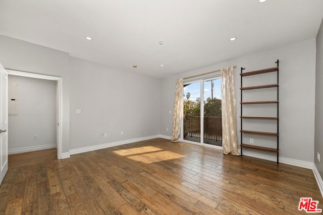 empty room with dark wood-type flooring