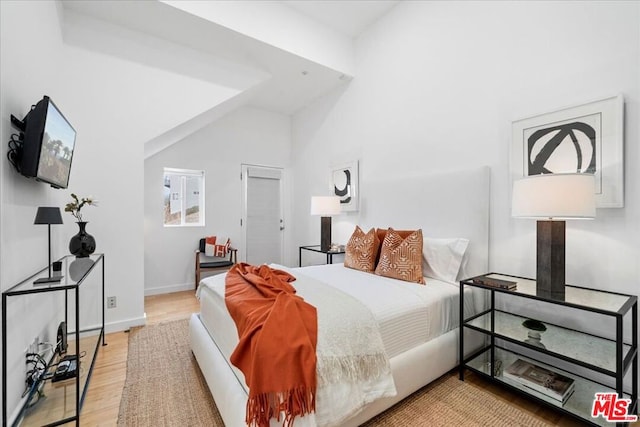 bedroom with wood-type flooring