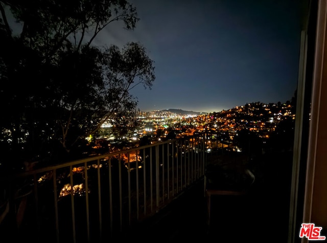 view of balcony at twilight