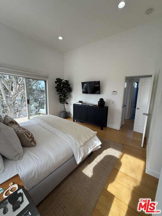 bedroom with light hardwood / wood-style floors