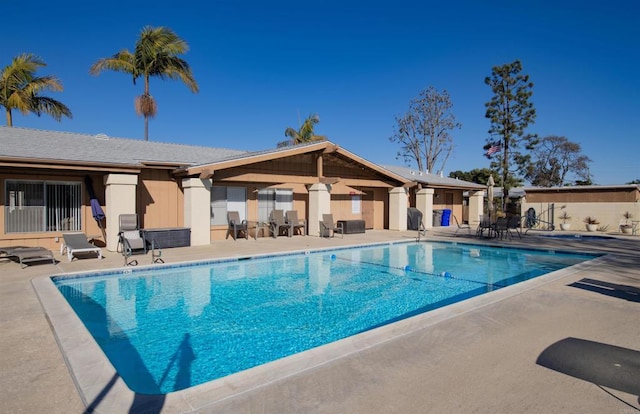 view of swimming pool with a patio area