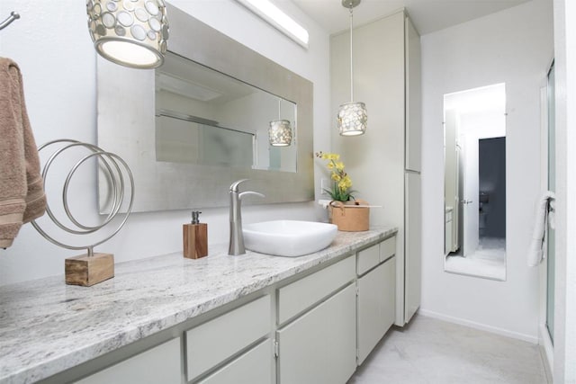 bathroom featuring vanity and a shower with shower door