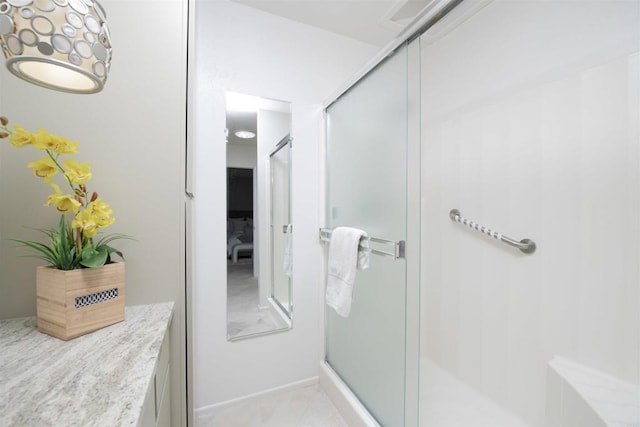 bathroom with a shower with shower door