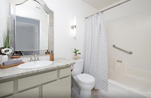 full bathroom with vanity, shower / tub combo, and toilet