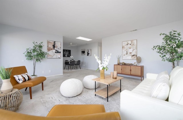 living room featuring a skylight