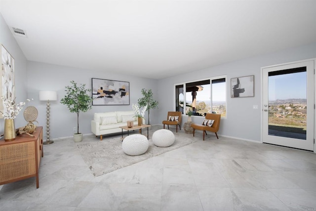 sitting room featuring baseboards and visible vents