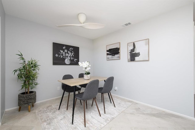 dining room featuring a ceiling fan, visible vents, and baseboards