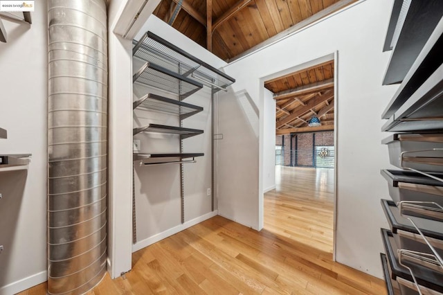 interior space featuring light hardwood / wood-style floors and wooden ceiling