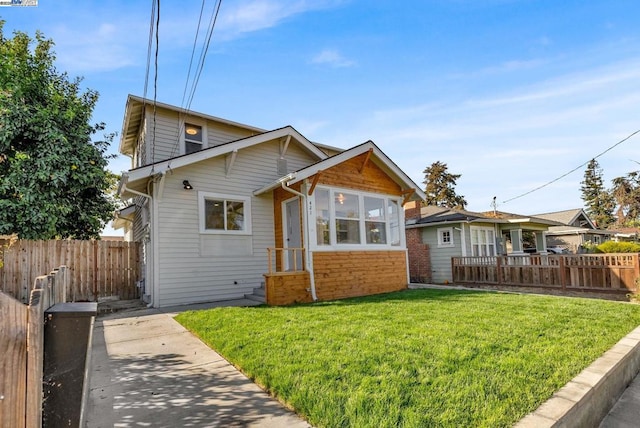 back of property featuring a lawn