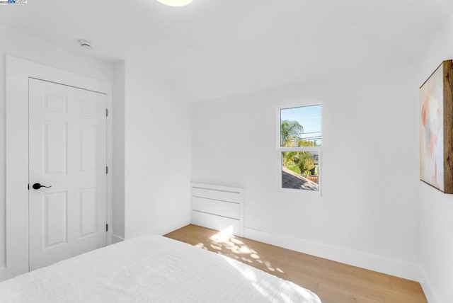 bedroom with light wood-type flooring