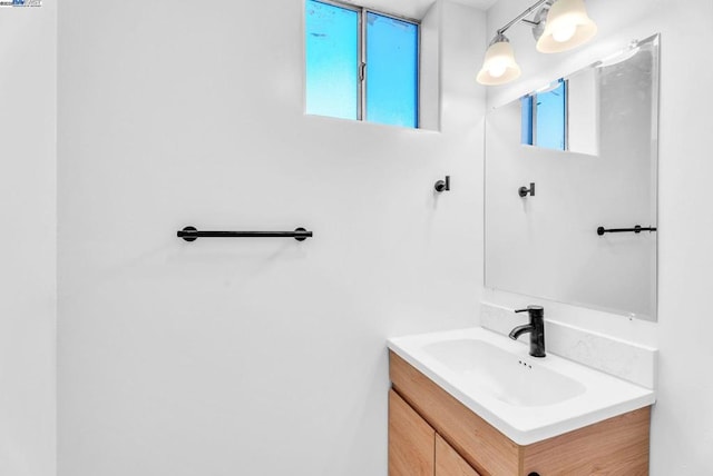 bathroom with vanity and plenty of natural light