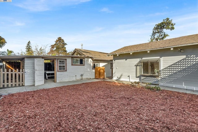 back of property with a patio