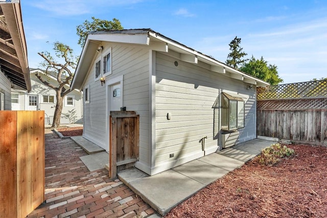 rear view of property featuring a patio area