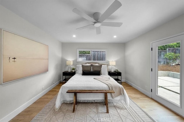 bedroom with access to exterior, light hardwood / wood-style flooring, and ceiling fan