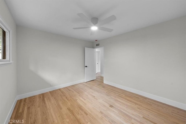 unfurnished room featuring ceiling fan and light wood-type flooring