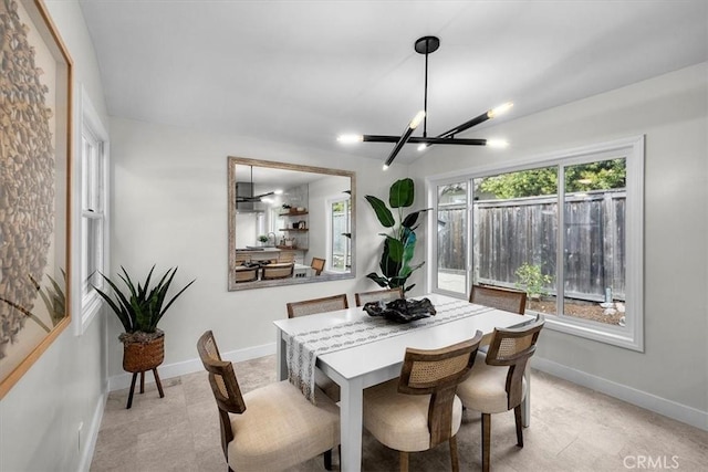 dining area featuring a notable chandelier