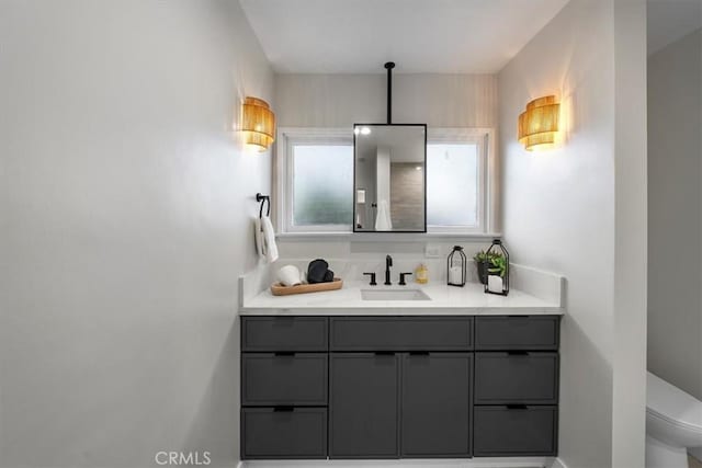 bathroom with vanity and toilet