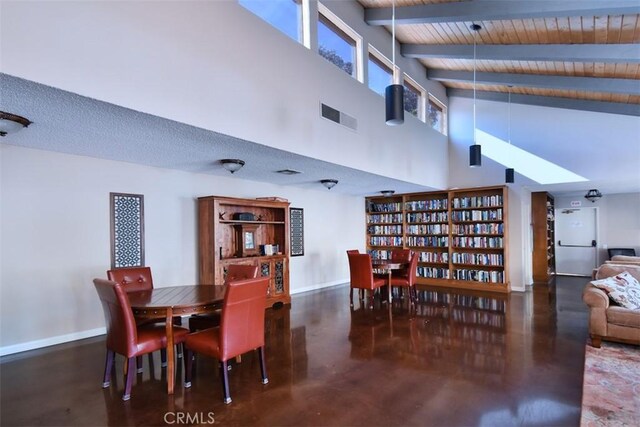 dining space featuring high vaulted ceiling, beam ceiling, and wooden ceiling