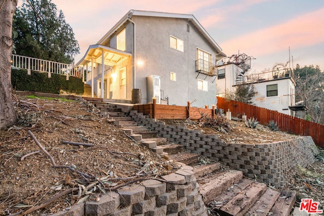 view of property exterior at dusk