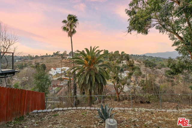 yard at dusk with a mountain view