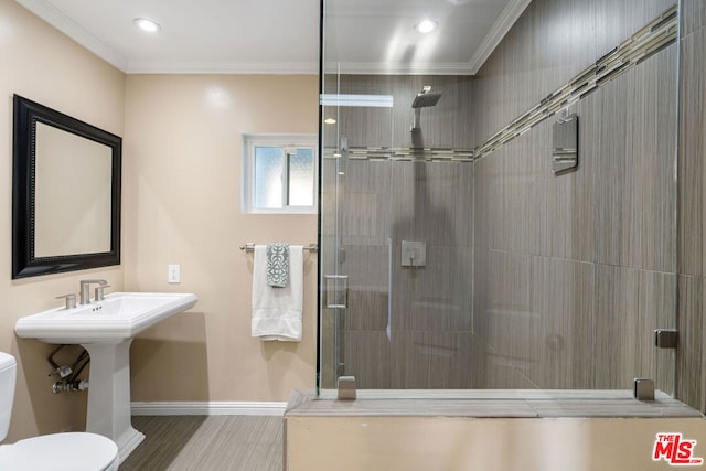 bathroom with crown molding, toilet, and walk in shower