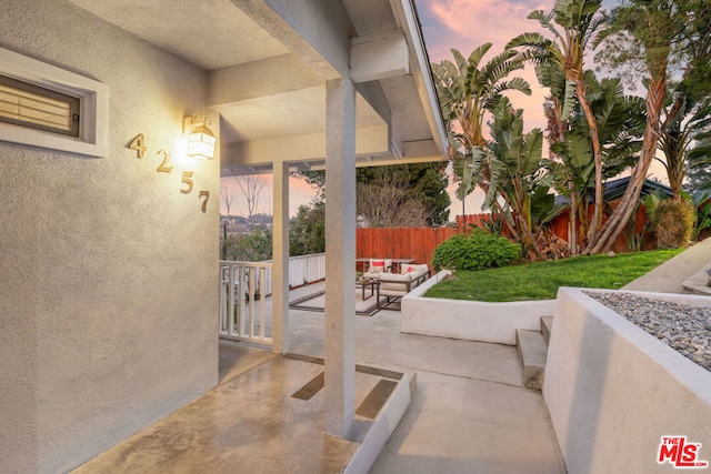 patio terrace at dusk with outdoor lounge area