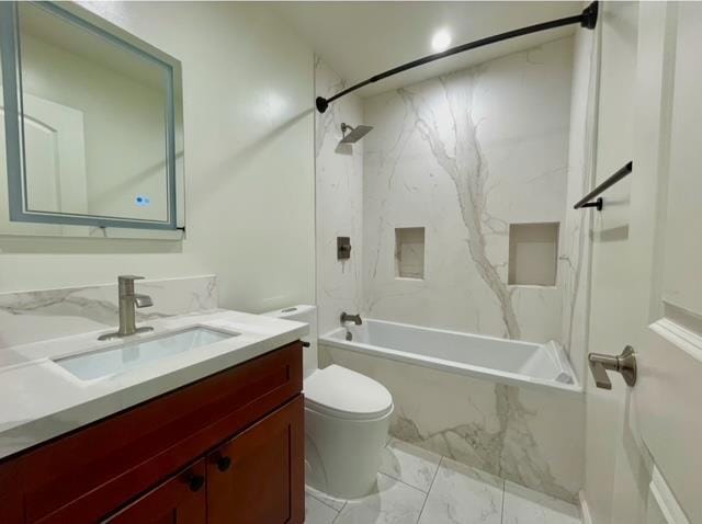 full bathroom featuring vanity, tiled shower / bath combo, and toilet