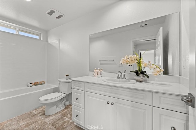 full bathroom featuring vanity, shower / bathing tub combination, and toilet