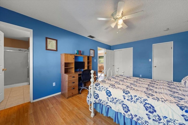 bedroom featuring a textured ceiling, ceiling fan, and light hardwood / wood-style flooring