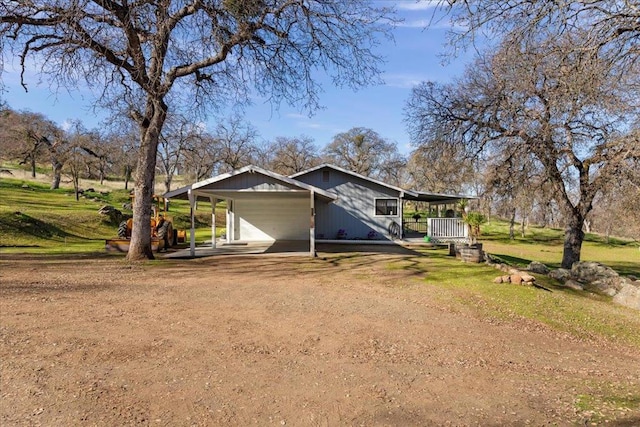 view of property exterior featuring a carport and a lawn