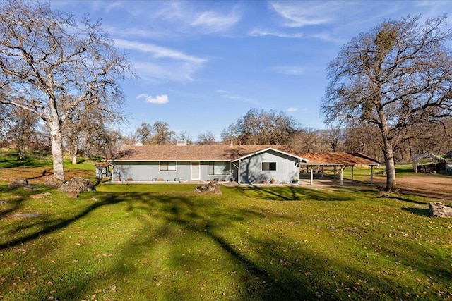 back of house with a yard