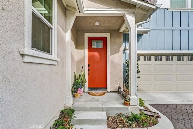 doorway to property featuring a garage