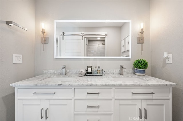 bathroom featuring vanity and an enclosed shower