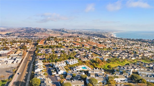 bird's eye view with a water and mountain view