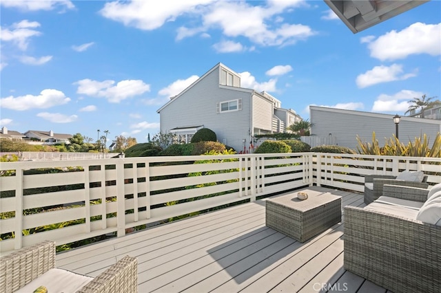 wooden deck featuring an outdoor hangout area