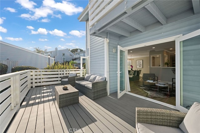 wooden deck featuring an outdoor living space