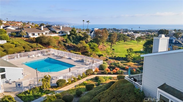 view of pool featuring a water view