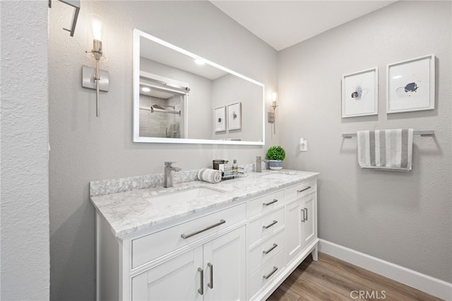 bathroom featuring vanity and hardwood / wood-style flooring