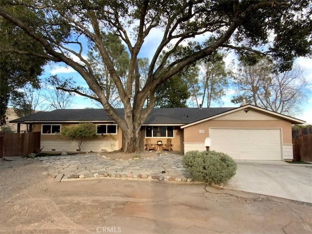 ranch-style home with a garage