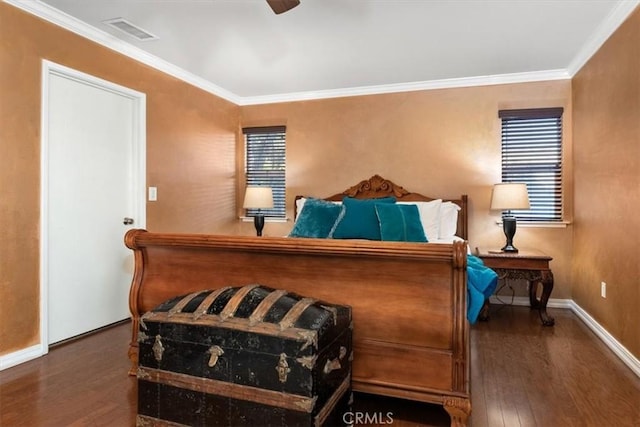 bedroom with multiple windows, ornamental molding, dark wood-type flooring, and ceiling fan