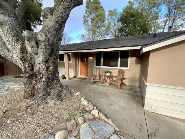 property entrance with a patio