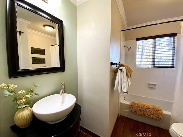 bathroom featuring toilet, ornamental molding, and shower / bathtub combination with curtain