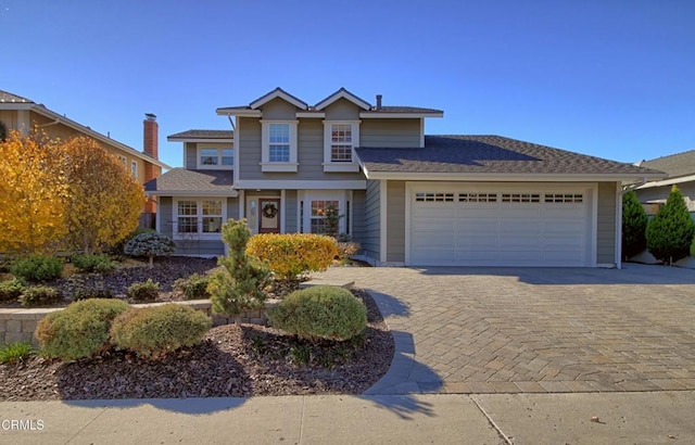 view of front of property with a garage