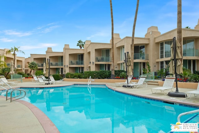 view of swimming pool with a patio area