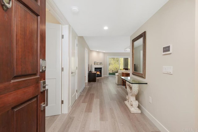 corridor featuring light hardwood / wood-style floors