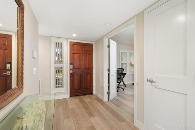 foyer with light hardwood / wood-style floors