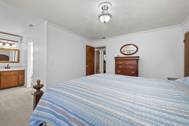 carpeted bedroom with ornamental molding, ensuite bathroom, a wall mounted AC, and sink