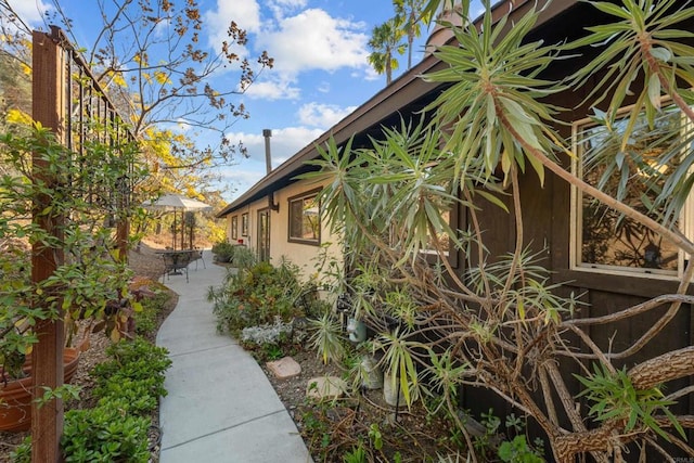 view of side of home featuring a patio area