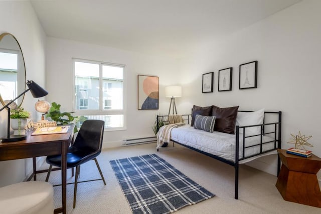 carpeted bedroom featuring a baseboard radiator