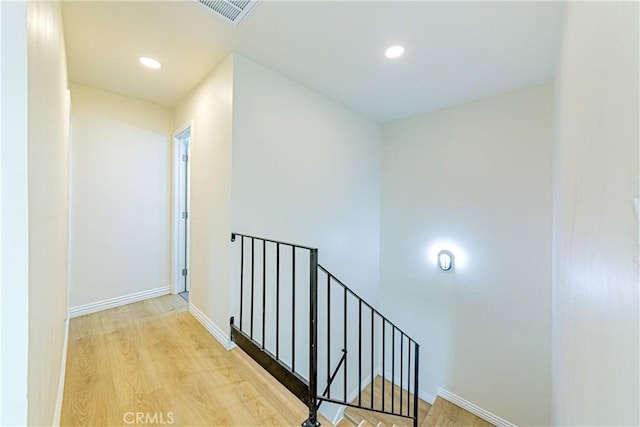 corridor with light wood-type flooring